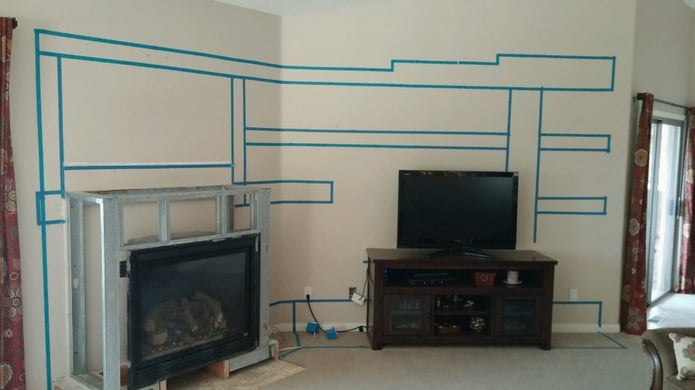 Mapping out the shelving unit with masking tape
