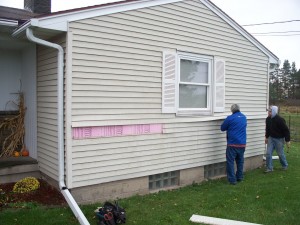 Removing exterior siding from the front of the house gave Matt the panels he would need to cover his closed off window from earlier home remodeling.