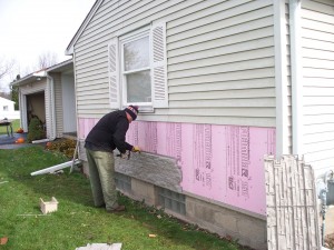 After removal, the home remodeling project continued with the addition of new siding panels.