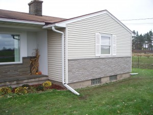 Stone look siding installed on a remodeled New York home