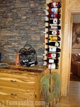 Faux stone panels beautifully complete this home wine cellar.