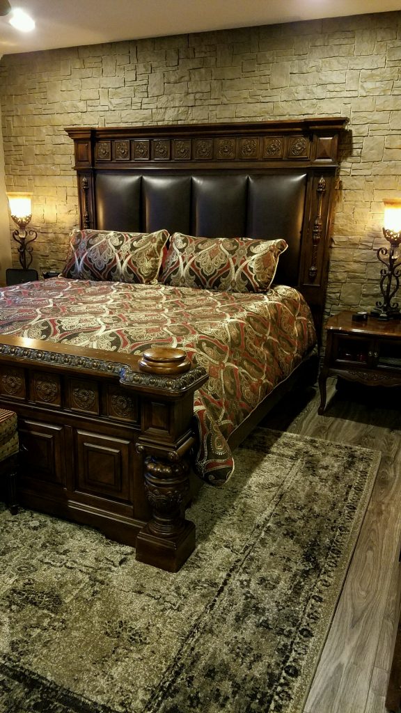 Bedroom focal wall made from Novi Stone Wall panels in Moka color.