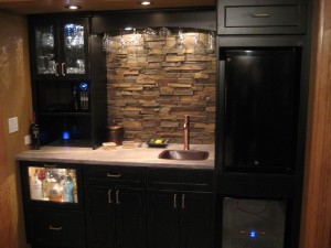 Compact kitchen's backsplash created with faux panels.