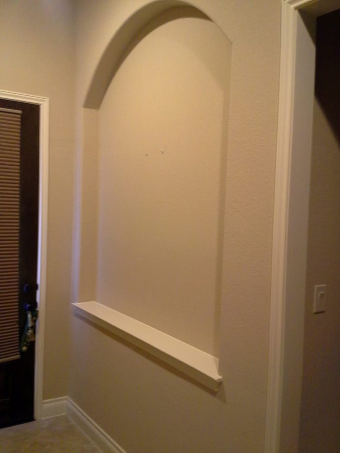 BEFORE: You can see how being able to trim our panels with a wood saw made it easier for Mike to fit them perfectly in this alcove.
