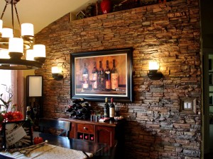 It's amazing just how simple a design like this can be to install. No need for extra supports and a masonry team on this project... faux stone panels look incredibly realistic but their much lighter and simple to install.