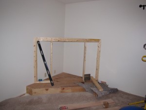 Kerby created an entire enclosure of 2x4s and plywood for his fireplace frame.