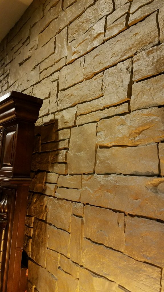 Close-up view of bedroom focal wall created with Novi Stone Wall panels in Moka.