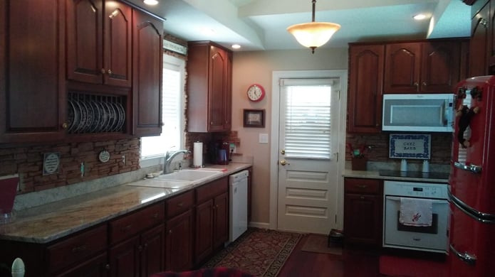 The backsplash panels blend beautifully with the rest of the kitchen's decor.