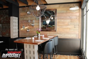 Reclaimed barnboard panels and trim combine to make this wall look incredibly realistic.