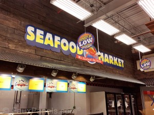 Faux wood panels give this store front a fantastically-realistic finish.