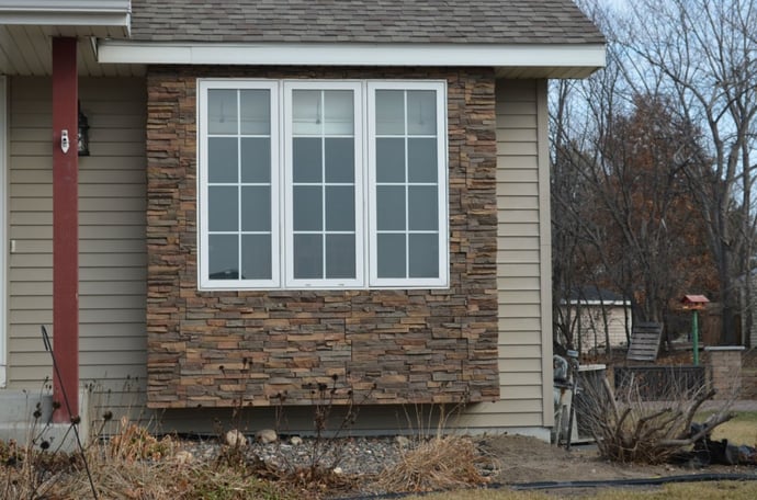 Close up view of the new siding around the front windows.