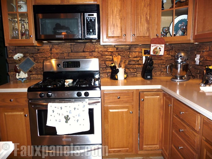 Kitchen counter area with moisture-resistant panels added for the backsplash.