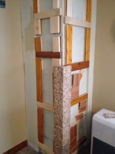 Prepping the corner wall prior to panel installation.