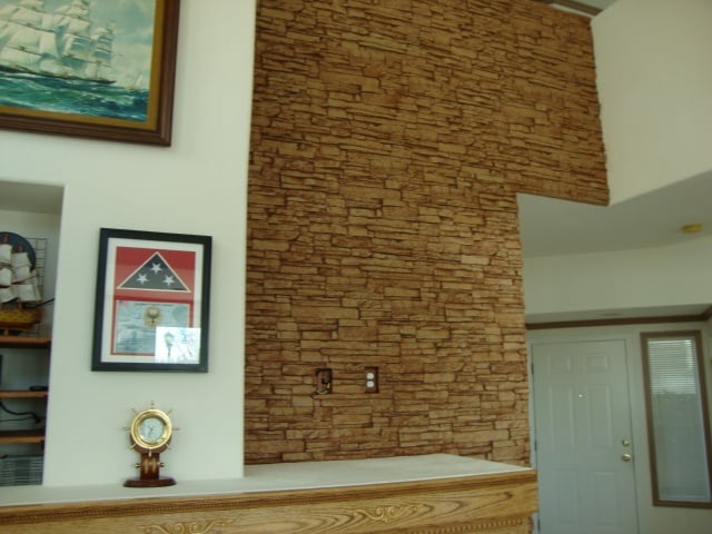 All things being equal, the wall took a fraction of the time using real stone or brick would have done.