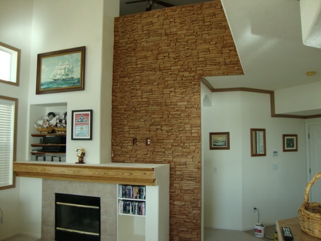 Fireplace wall created in two weekends with Norwich Stacked Stone panels in Cajun color.