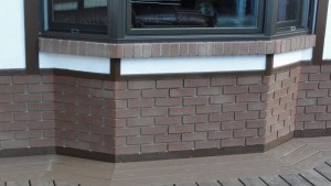 Up close, these fake brick panels still look just like the real thing.