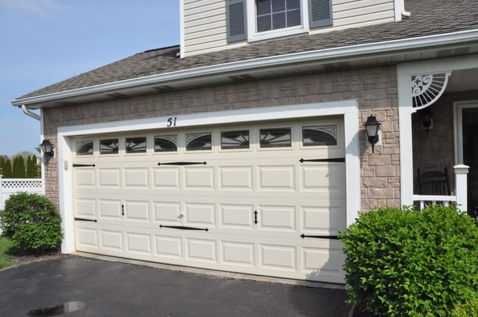 Replacing the vinyl siding with faux rock on parts of this Rochester, NY home gave it an exciting new look.