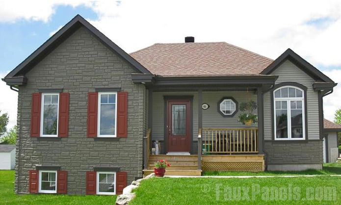 Installing drainage mats under imitation stone siding doesn't take long at all.