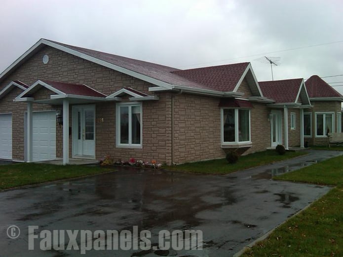Adding drainage mats underneath imitation stone siding decrease the chance of water leaks due to rain.