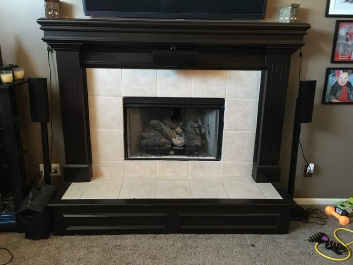 The old white tile fireplace surround looked incredibly dated.