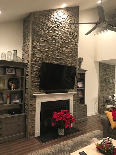 AFTER: The fireplace looks like it's really made from hand-stacked stone.
