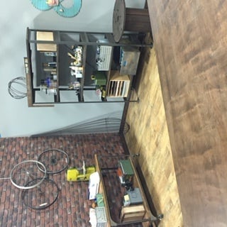 Craft corner built on PBS' show Make It Artsy, with a faux brick accent wall