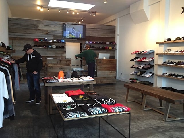 Reclaimed Barn board paneling adds a cozy feel to retail environments.