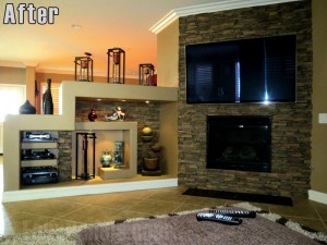 Wall accent for a family room's fireplace created with dry stack stone panels.