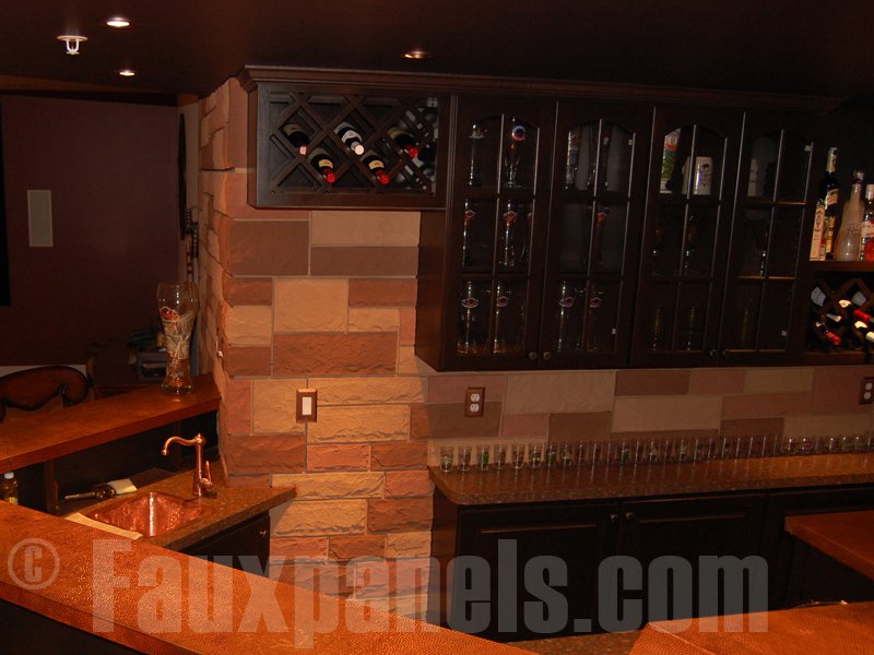 Home bar with random rock backsplash