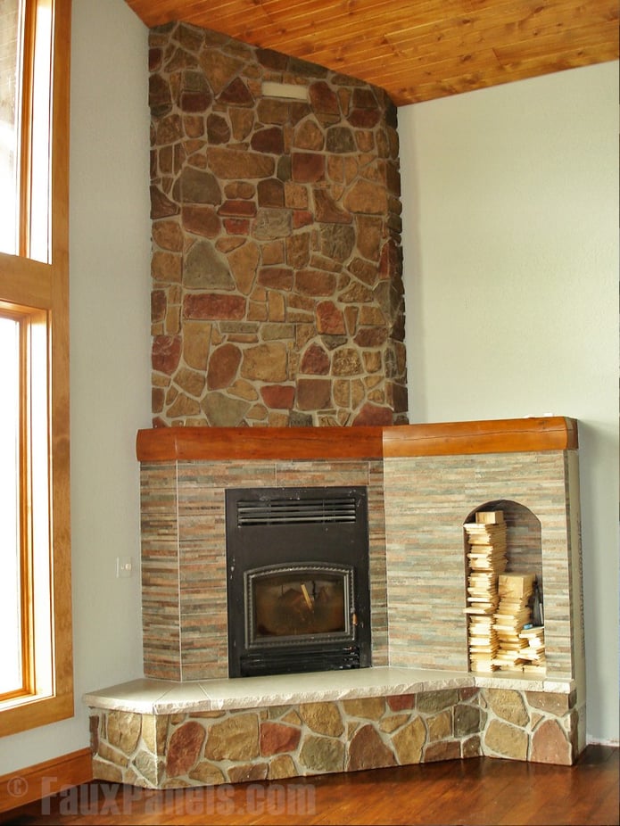 Fireplace covered in tan Fieldstone veneer