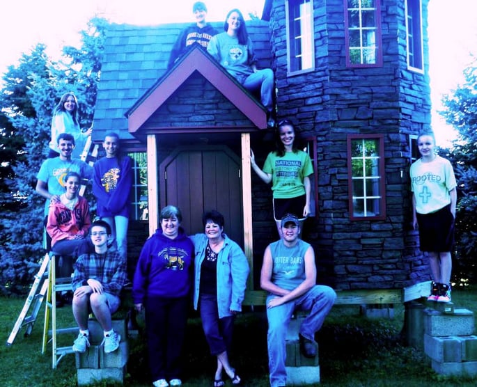 Venture Crew 630 stands proudly with their Enchanted Castle of Dreams.
