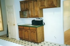 Kitchen before remodeling with faux stone panels