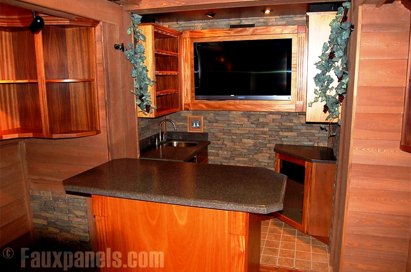 A stone veneer entertainment center wall adds comfort and beauty.