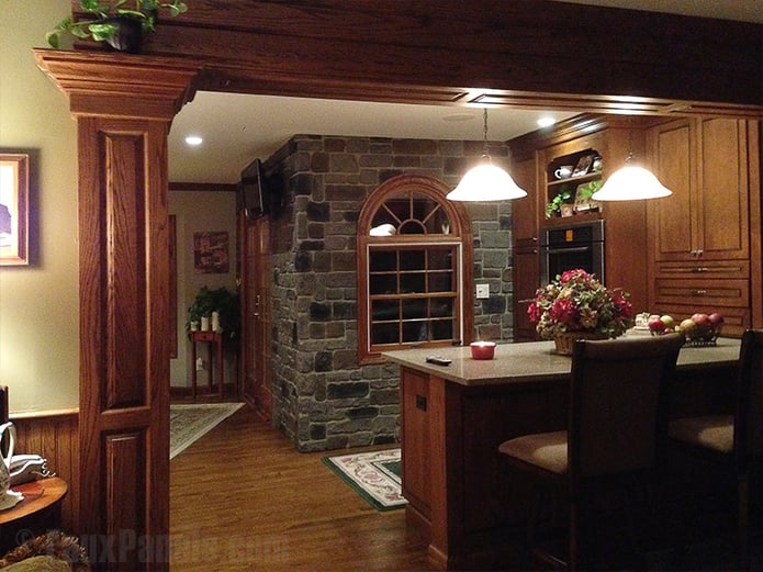Kitchen with cobblestone accent wall.