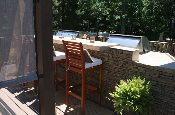 Grill island surfaced with faux stone as an alternative to heavy natural stone.