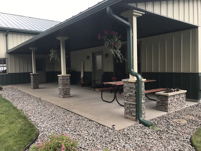 Front porch remodel with the addition of stacked stone style columns.
