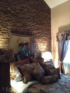 Your bedroom remodel can get an upgrade with a stacked stone wall.