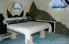 Rock veneer panels complete this master bedroom design