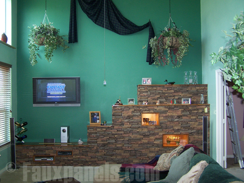 Living room shelves covered in dry stack stone panels.