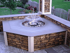 Stylish porch water fountain with faux stone panels attached to the base.
