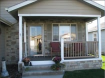 A home's exterior siding gains new dimensions with fake stone ledgestone paneling.