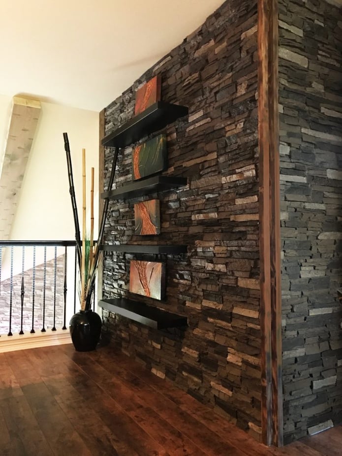 Wooden edging around the panels is a beautiful and practical way to address the wall corners.