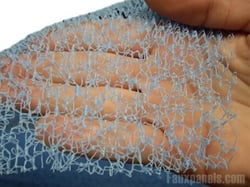 Blue drainage mats are lightweight and easy to install under imitation stone siding.