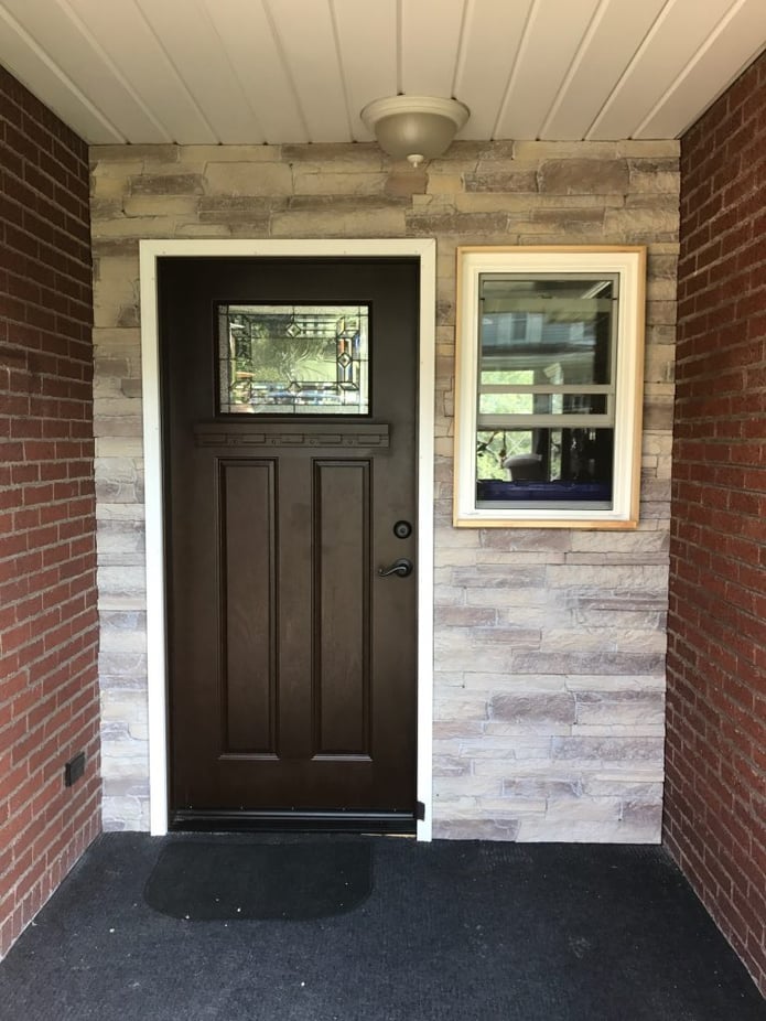 Front door surround created with Norwich Dakota Stonewall panels in Toasted Vanilla.