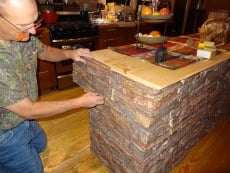 Continue installing the remaining panels on your kitchen island as needed.