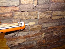 Add caulk to any gaps or seams in the panels along your kitchen island. 