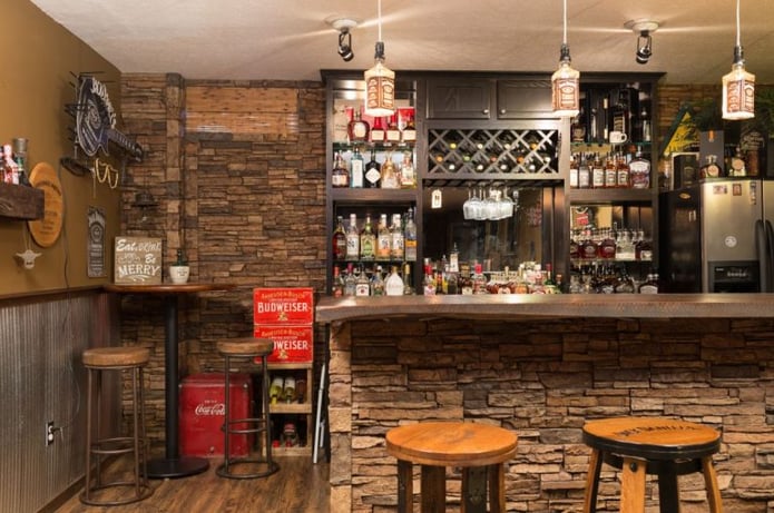 Basement bar accented with stacked stone panels in Sierra Brown color.
