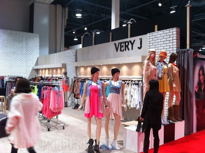 Artificial brick panels in white provide a distinctive decor for this apparel shop.