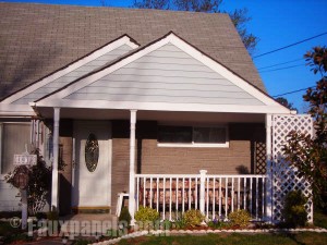 House with Nailon Desert Buff Faux Siding