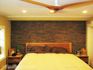 A bedroom remodel with stacked stone walls feels even more comfortable.